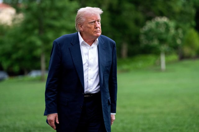 US President Donald Trump walks on the South Lawn of the White House after arriving on Marine One in Washington, DC, US, on Sunday, May 4, 2025.