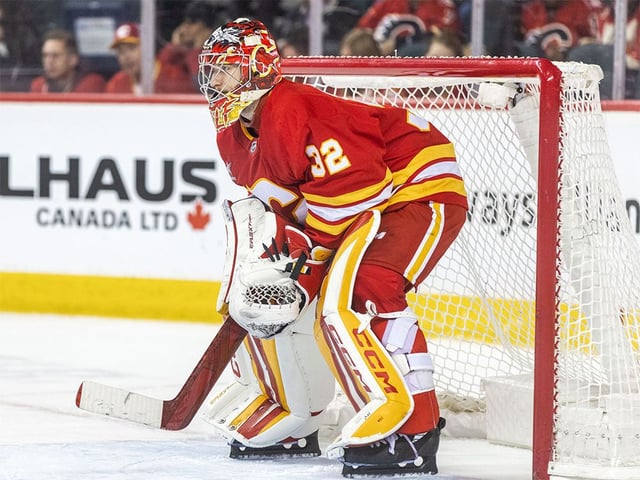 Calgary Flames goaltender Dustin Wolf readies for 3-on-3 overtime against the Vegas Golden Knights at the Scotiabank Saddledome on Tuesday, April 15, 2025.