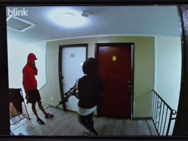 AURORA, COLORADO - OCTOBER 28: Cindy Romero holds the viral surveillance video she posted, which allegedly shows armed members of the Tren de Aragua gang at her former apartment building in Aurora, Colorado, on October 28, 2024.
