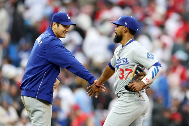 PHILADELPHIA, PENNSYLVANIA - APRIL 05: Shohei Ohtani #17 and Teoscar Hernández #37 of the Los Angeles Dodgers celebrate a win over the Philadelphia Phillies at at Citizens Bank Park on April 05, 2025 in Philadelphia, Pennsylvania.