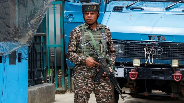 An Indian security force personnel stands guard on a street, following the Pahalgam attack in Kashmir.