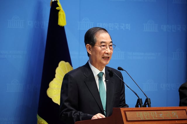 South Korea's former acting President Han Duck-soo speaks during a press conference to announce a presidential bid at the National Assembly in Seoul, South Korea, May 2, 2025.   REUTERS/Kim Hong-Ji/File Photo
