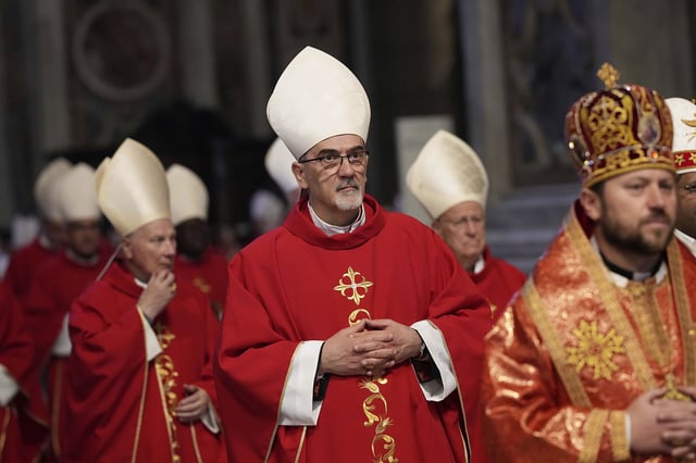 Cardinal Pizzaballa arrives in procession for a mass on the seventh of nine days of mourning for the late Pope Francis in St. Peter's Basilica last week.