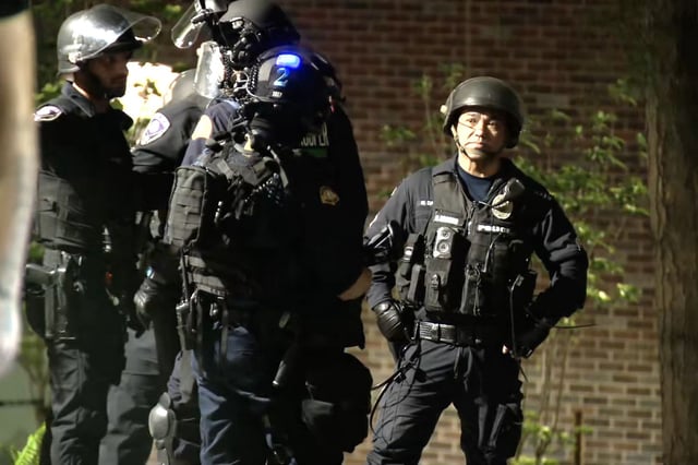 Police respond to pro-Palestinian protests at the University of Washington's Interdisciplinary Engineering Building on Monday evening.