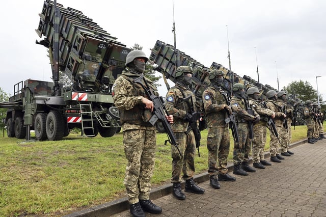 German and Ukrainian soldiers stand in front of &#34;Patriot&#34; anti-aircraft missile systems during the visit of Ukrainian President Zelensky to a military training area on June 11, 2024.