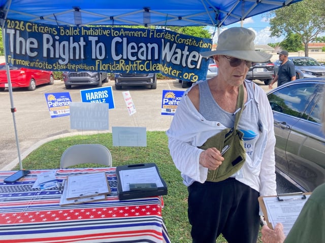 A volunteer sought petitions for a clean water amendment at  an early voting site in Tamarac last October.