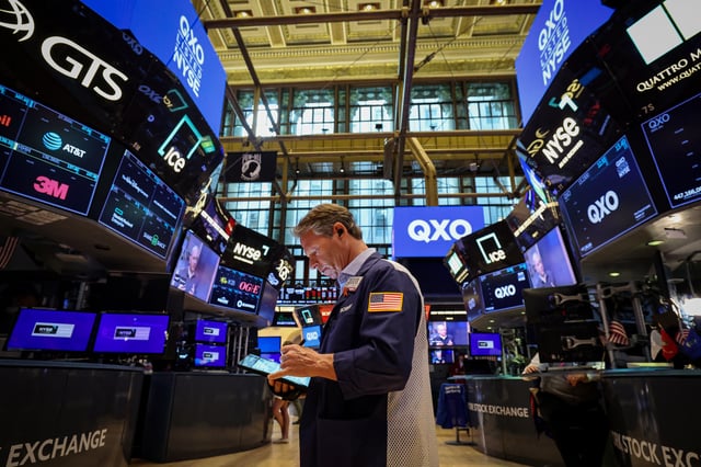 A trader works on the floor at the New York Stock Exchange (NYSE) in New York City, U.S., April 30, 2025.  REUTERS/Brendan McDermid/File photo