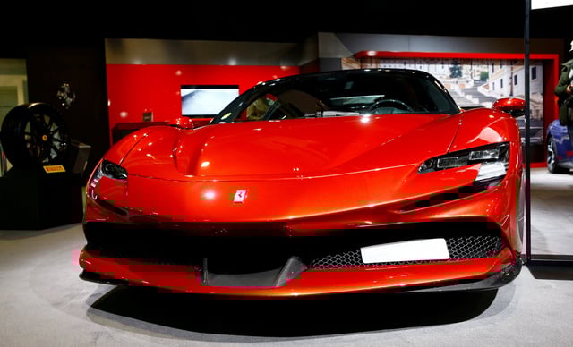 A Ferrari SF90 Stradale hybrid sports car is seen during a media preview at the Auto Zurich Car Show in Zurich, Switzerland November 3, 2021. REUTERS/Arnd Wiegmann/File Photo
