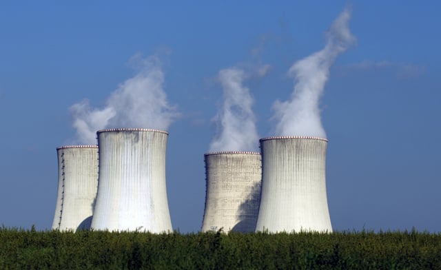 FILE - Four of the cooling towers of the Dukovany nuclear power plant rise high above the natural surroundings of Dukovany, Czech Republic, Sept. 27, 2011. (AP Photo/Petr David Josek, File)