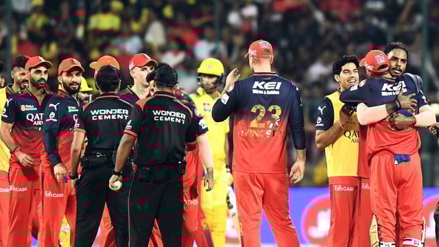 Royal Challengers Bengaluru's players celebrate after winning the IPL 2025 match against Chennai Super Kings, at M. Chinnaswamy Stadium in Bengaluru
