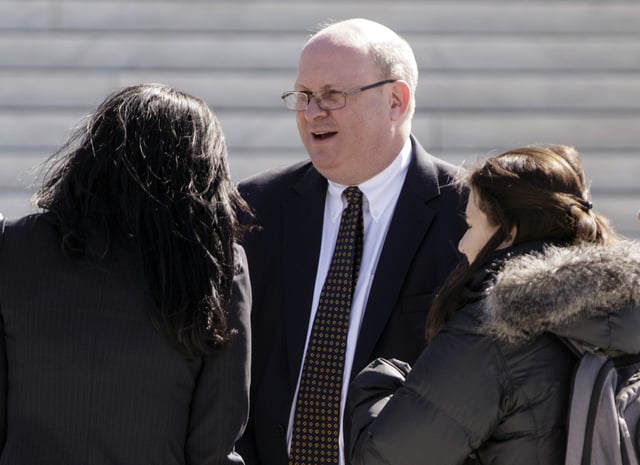 Attorney Marc Elias stands on the plaza of the Supreme Court in Washington, March 21, 2016.