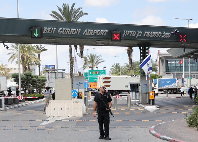 A security personnel stands at the entrance of Ben Gurion Airport following a missile attack launched from Yemen, in Tel Aviv, Israel May 4, 2025. REUTERS/Nir Elias