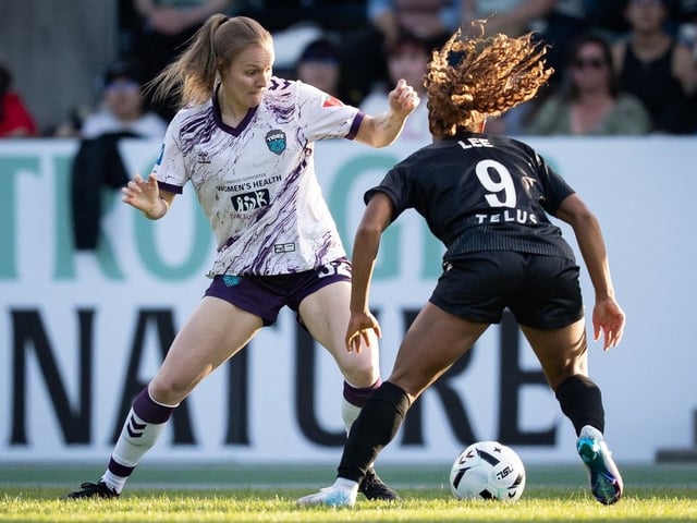 Halifax Tides FC midfielder Sydney Kennedy, left, is defended by Mariah Lee of Vancouver Rise FC Lee during Monday's Northern Super League game in Burnaby, B.C.