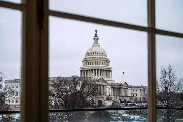 The Capitol is seen framed through a window in the Cannon House Office Building on Capitol Hill in Washington. Congress is working out the details of the reconciliation package — or President Donald Trump’s &#34;one big, beautiful bill&#34; — that would extend tax cuts, raise the debt ceiling and include some mandatory spending cuts. (J. SCOTT APPLEWHITE/AP FILE)
