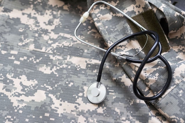 Stethoscope lies on the uniform of a US soldier.