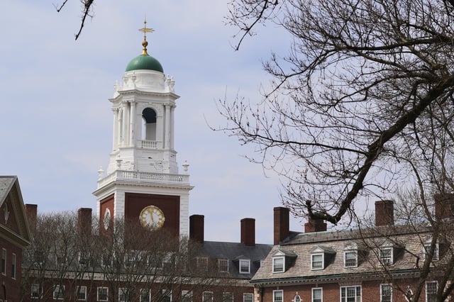 Spring buds appear on a tree near Eliot House, rear, at Harvard University, Tuesday, April 15, 2025, in Cambridge, Mass. (AP Photo/Charles Krupa)