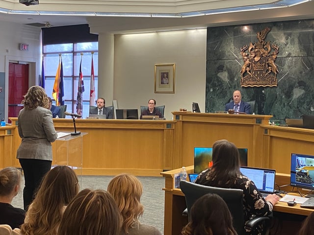 Leduc firefighter paramedic Christa Steele addresses city council.