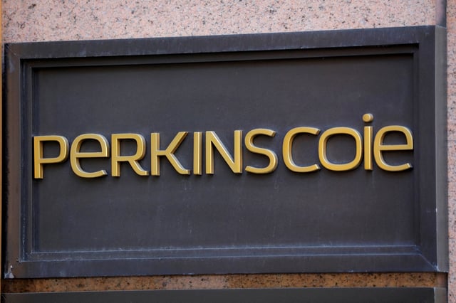 Signage is seen outside of the law firm Perkins Coie at their legal offices in Washington, D.C., U.S., May 10, 2021. REUTERS/Andrew Kelly/File Photo