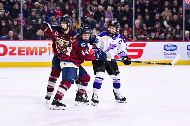 Amanda Boulier, left, of the Montreal Victoire holds back Kendall Coyne Schofield of the Minnesota Frost during the third period of their January 17, 2025, regular season game. Both teams will be competing in the PWHL playoffs.