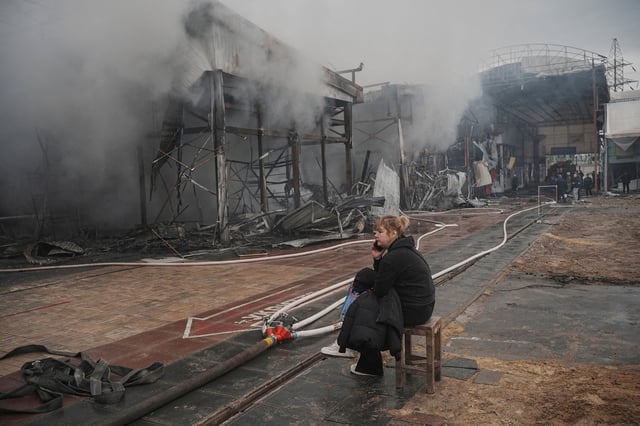 A vendor sits at the site of the Barabashovo market hit by Russian drone strike, amid Russia's attack on Ukraine, in Kharkiv, Ukraine, May 6, 2025. REUTERS/Viktoriia Yakymenko/File Photo