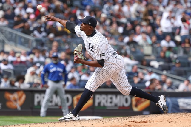 Apr 27, 2025; Bronx, New York, USA; New York Yankees relief pitcher Yerry de los Santos (73) delivers a pitch during the seventh inning against the Toronto Blue Jays at Yankee Stadium. Mandatory Credit: Vincent Carchietta-Imagn Images/File Photo