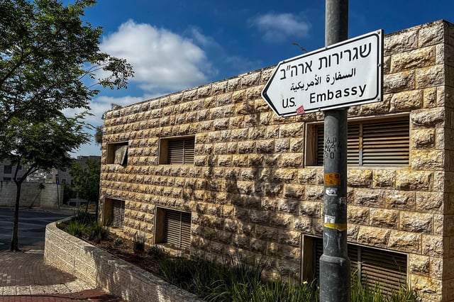 A road sign shows the way towards the US embassy in Jerusalem on April 19.