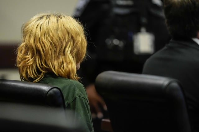 Colt Gray, charged as an adult with four counts of murder, sits in the Barrow County courthouse during his first appearance for the shooting at Apalachee High School, Sept. 6, 2024, in Winder, Ga.
