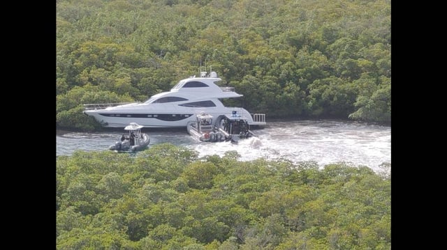 Video released by the sheriff’s office shows multiple patrol boats with armed deputies surrounded the yacht and brought it to a stop.