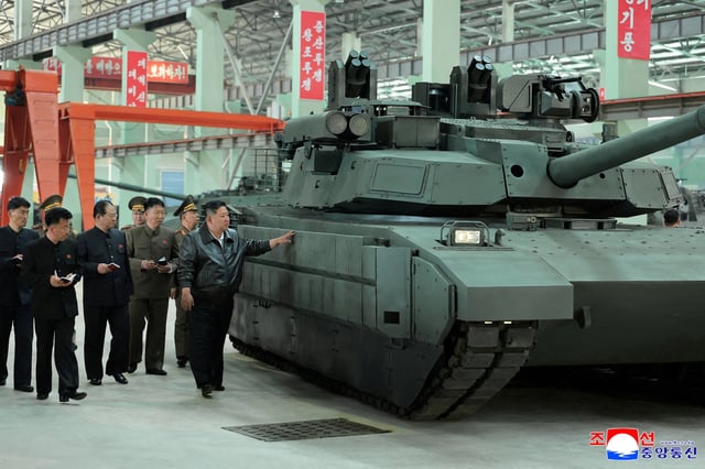 North Korea's leader Kim Jong Un touches tank armour as he tours a military equipment facility at an unspecified location in North Korea, in this image released May 4, 2025 by the Korean Central News Agency. KCNA via REUTERS/File Photo