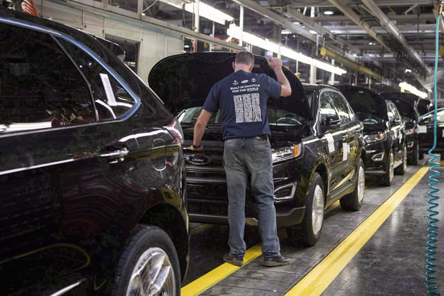 New Ford Edges sit on a production line as Ford Motor Company celebrates the global production start of the 2015 Ford Edge at the Ford Assembly Plant in Oakville, Ont., on Feb. 26, 2015. The Canadian and Mexican governments are pressing the U.S. to explain its auto proposal at the current round of NAFTA talks.