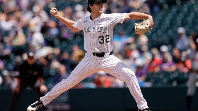Apr 30, 2025; Denver, Colorado, USA; Colorado Rockies starting pitcher Chase Dollander (32) pitches in the second inning against the Atlanta Braves at Coors Field. Mandatory Credit: Isaiah J. Downing-Imagn Images
