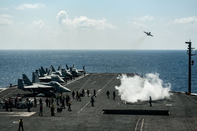 An F18 Hornet fighter jet can be seen taking off from the 330 meters navy aircraft carrier USS Harry S. Truman in the eastern Mediterranean Sea on May 8, 2018. (Photo by Aris MESSINIS / AFP) (Photo by ARIS MESSINIS/AFP via Getty Images)