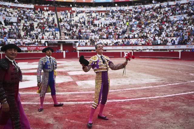 Mexican bullfighter Diego Silveti smiles at fans in the bullring after a bullfight in Aguascalientes, Mexico, Sunday, April 27, 2025. (AP Photo/Eduardo Verdugo)