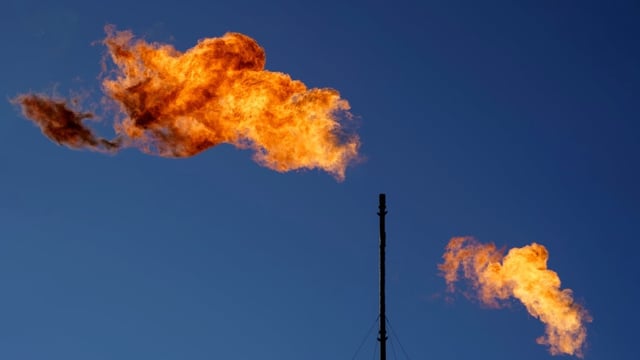 Flares burn off methane and other hydrocarbons at an oil and gas facility in Texas. Canada is seen as a global leader on methane policy, but other countries like U.S. are drawing back on action on the potent greenhouse gas.