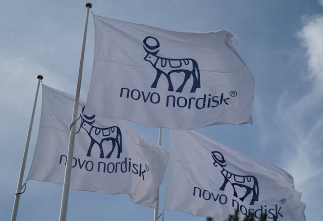 Flags with the Novo Nordisk logo flutter outside their Danish company's offices in Copenhagen, Denmark, September 26, 2023. REUTERS/Tom Little/File Photo