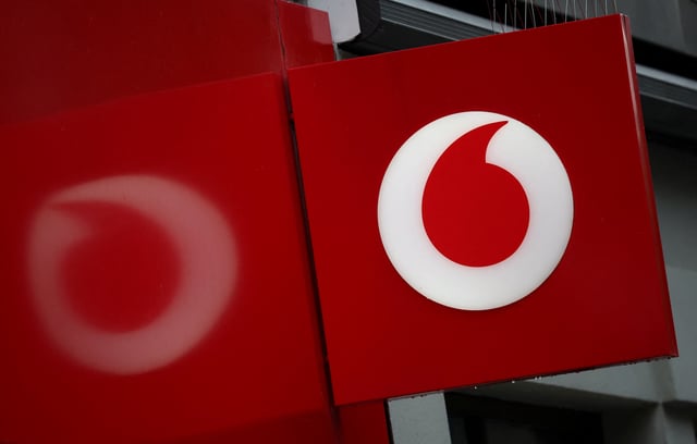 A view of a signage outside a Vodafone mobile phone store in Liverpool, Britain, October 8, 2024. REUTERS/Phil Noble/File Photo