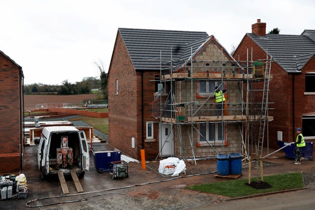 Work proceeds on the construction site of residential buildings in Worcester, Britain December 5, 2024. REUTERS/Temilade Adelaja/File Photo