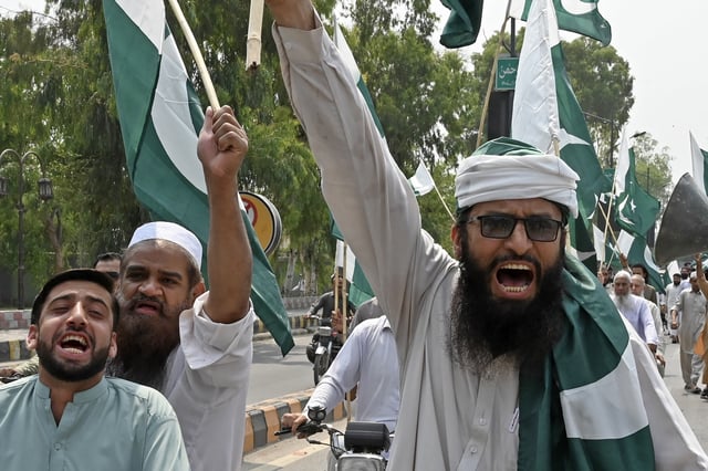 Members of the Pakistan Central Muslim League take part in an anti-India demonstration in Peshawar on May 7, 2025, as border tensions rise following Indian strikes in Pakistan.
