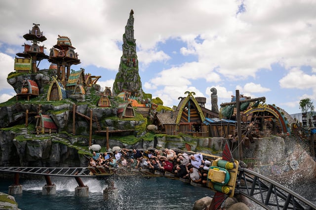 Guests ride the Hiccup's Wing Gliders rollercoaster in the How to Train Your Dragon - Isle of Berk area, at  Epic Universe theme park in Orlando, Florida on Saturday, April 5, 2025.