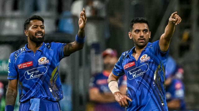 Mumbai Indians' Deepak Chahar (R) and captain Hardik Pandya