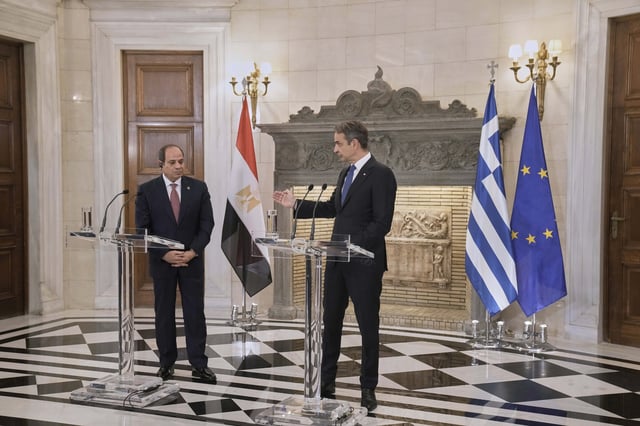 Greece's Prime Minister Kyriakos Mitsotakis, right, speaks next to Egyptian President Abdel-Fattah el-Sissi during a joint news conference and after their meeting, in Athens, on Wednesday, May 7, 2025. (AP Photo/Petros Giannakouris)