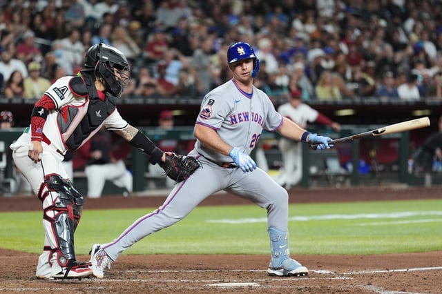 New York Mets&#39; Pete Alonso, right, is tagged out by Arizona Diamondbacks catcher Jose Herrera after a dropped third strike during the sixth inning of a baseball game Tuesday, May 6, 2025, in Phoenix. (AP Photo/Ross D. Franklin)