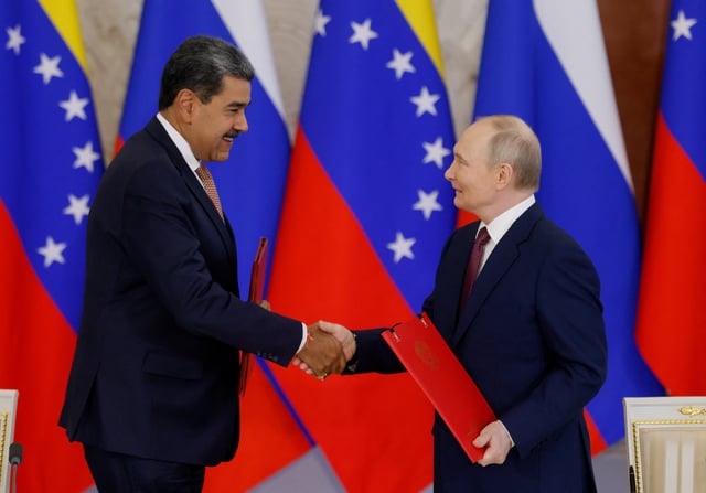 Russian President Vladimir Putin shakes hands with Venezuelan President Nicolas Maduro during a signing ceremony following their talks at the Kremlin in Moscow, Russia, May 7, 2025. REUTERS/Maxim Shemetov