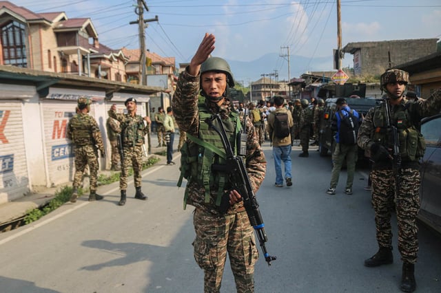 Indian paramilitary soldiers stand guard in Pampore, Pulwama district, south of Srinagar, Jammu and Kashmir, on May 7, 2025.