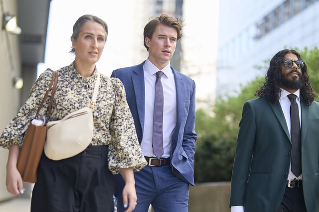 Carter Hart leaves the courthouse with this lawyer, Megan Savard, in London, Ont. on Friday, May 2, 2025.
