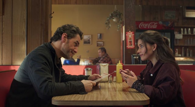 Quinn (Katie Douglas, right) and her physician father (Aaron Abrams) have moved to a small Midwestern town, where he will be assuming duties as the town’s only doctor in “Clown in a Cornfield.”