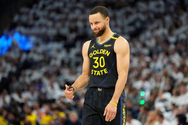 Golden State Warriors guard Stephen Curry gestures during the first half of Game 1 of an NBA second-round playoff series against the Minnesota Timberwolves in Minneapolis on May 6, 2025. 