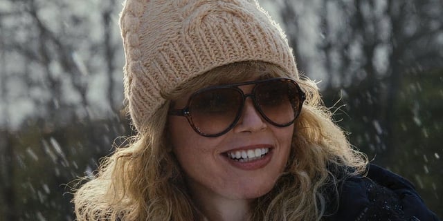 Natasha Lyonne as Charlie wearing a beanie in the snow in 'Poker Face'