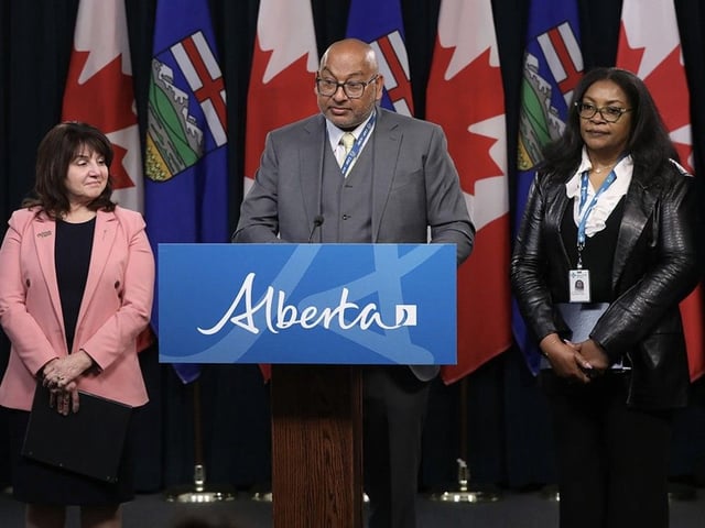 (From left to right) Health Minister Adriana LaGrange, interim chief medical officer of health Dr. Sunil Sookram, and central zone medical officer of health Dr. Ifeoma Achebe provide an update on the measles outbreak in the province during a press conference at the Alberta Legislature in Edmonton on Monday, May 5. 