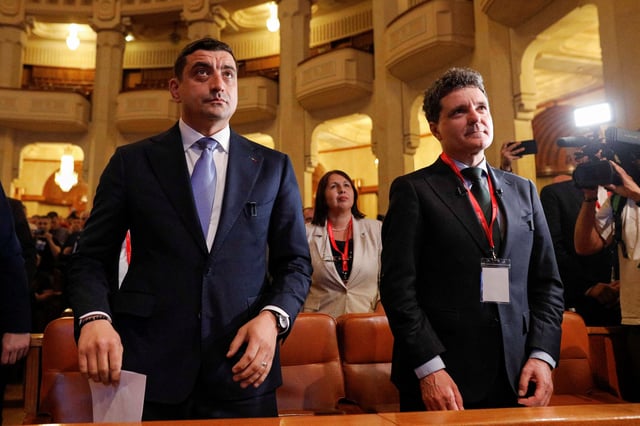 George Simion (left) and Nicusor Dan (right) attend a meeting of the National Union Bloc in Bucharest, Romania, May 7 2025. Inquam Photos/Malina Norocea via REUTERS